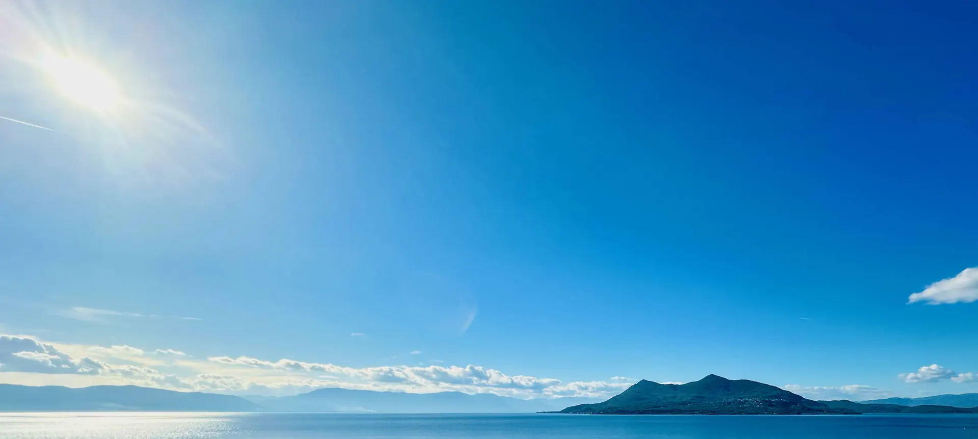 Sea view over Edipsos bay from the top floor of Alexiou Studios